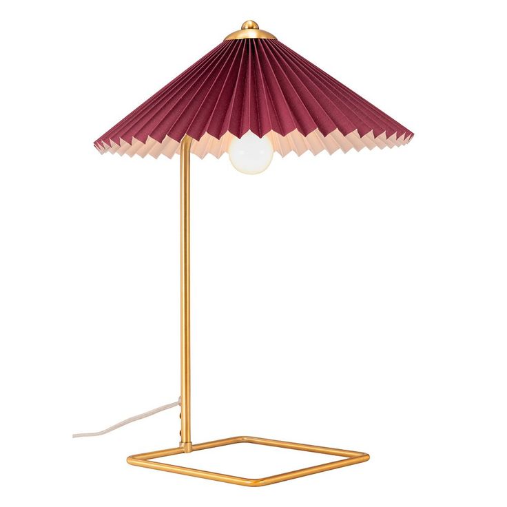 a red and gold lamp on a white background