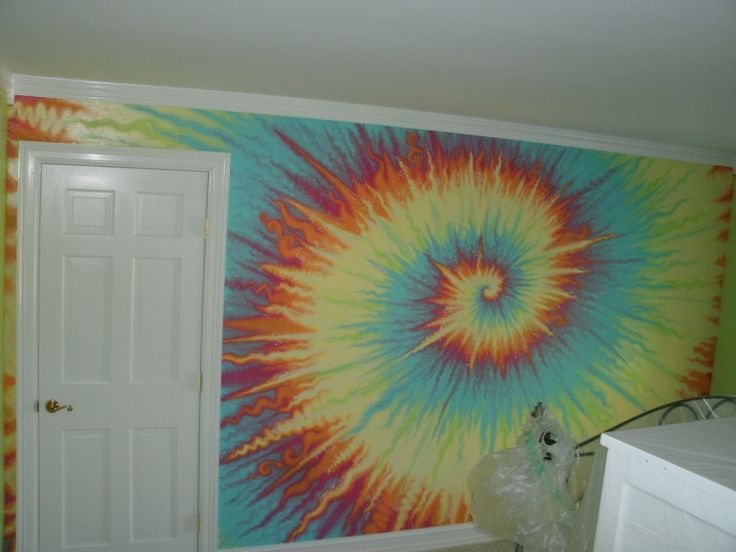 a room with a tie - dyed wall and washer