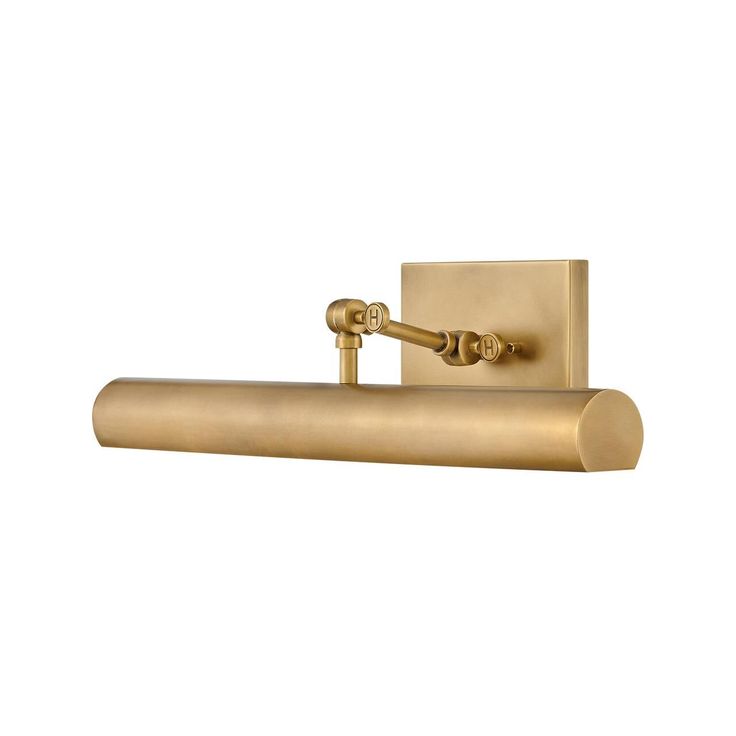 an antique brass finish bathroom light with two lights on each side and one arm in the middle