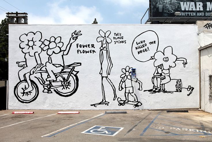 a large mural on the side of a building with people and flowers painted on it