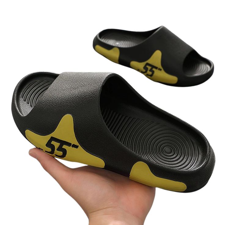 The 55 Blob Slides are sleek and cool looking slides that features a splash pattern with the numbers "55" on it. These slides are waterproof and very lightweight. Perfect shoes for a day spent outdoors. It comes with soft and comfortable sole making it suitable for daily use as well. FEATURES: Style Open toe Season Summer/Spring Sole Flat Vamp material EVA Size US ( 5.5 - 12) COMFORTABLE MATERIAL: The 55 Blob Slides are made of high-density material. These are light, soft, breathable, and waterp Casual Black Outdoor Slippers, Black Casual Breathable Slippers, Casual Black Breathable Slippers, Breathable Slides For Summer, Comfortable Breathable Black Slippers, Breathable Summer Slides, Non-slip Open Toe Slides For Streetwear, Black Waterproof Slides For Outdoor, Black Breathable Sandals For Streetwear