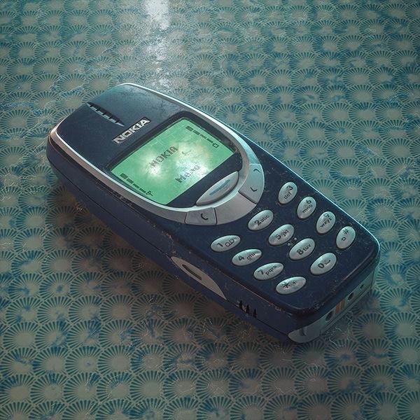 an old cell phone sitting on top of a blue and green tile floor with circles around it