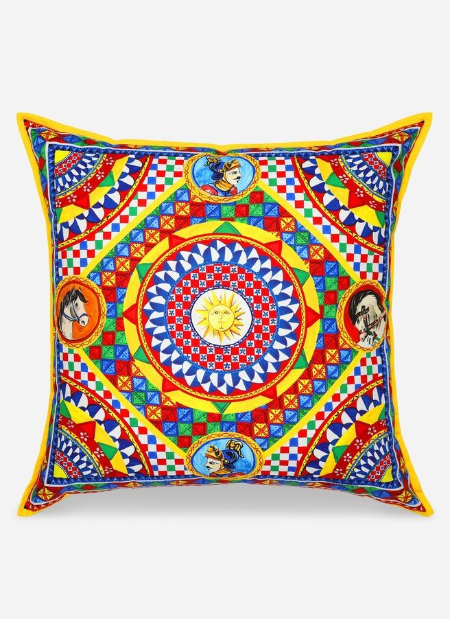 a decorative pillow with an abstract design on the front and sides, in bright colors