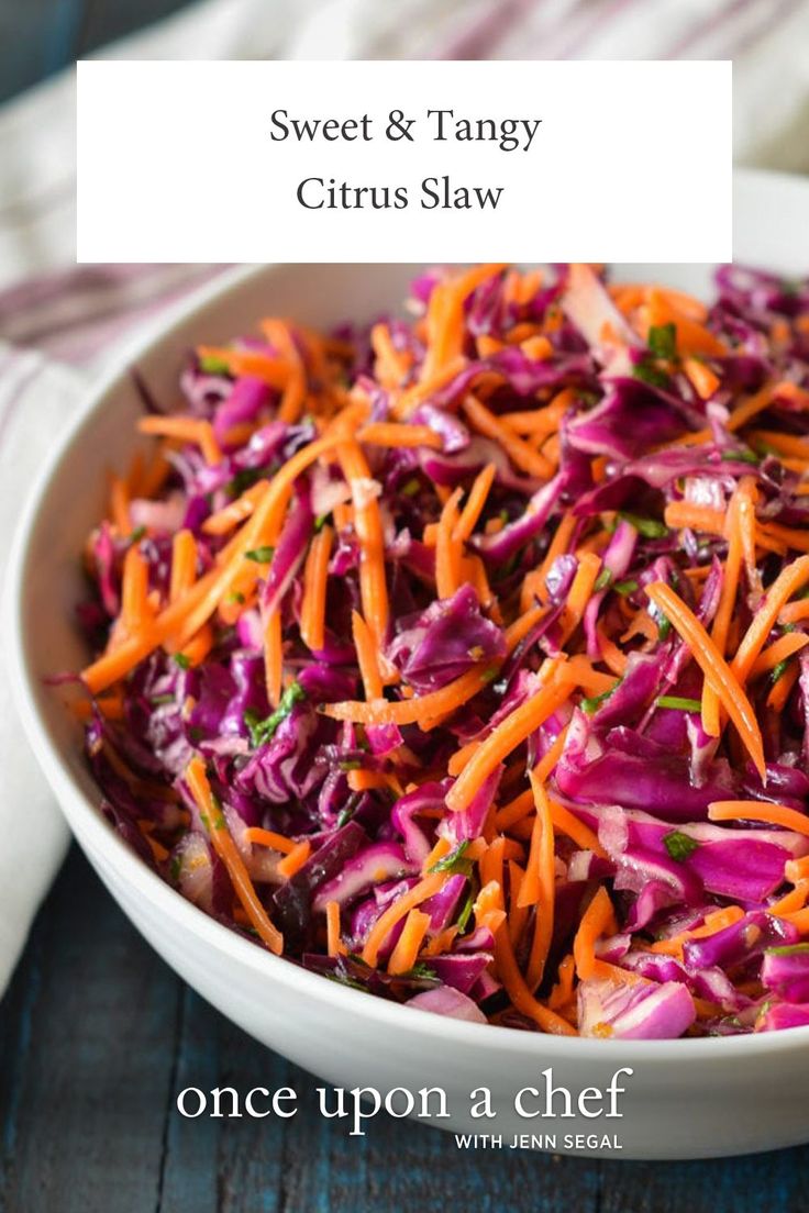 a white bowl filled with red cabbage and carrots