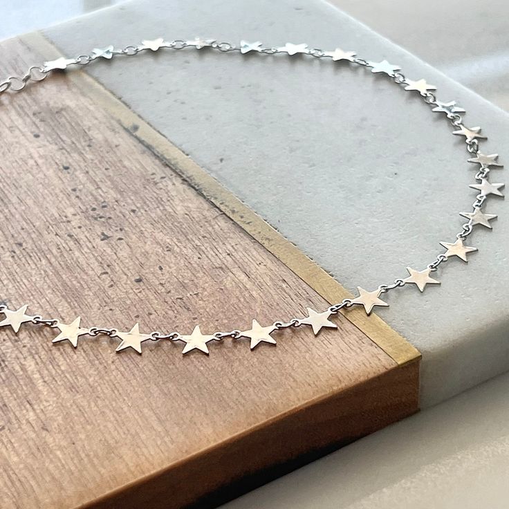 "Boho Beach Star Choker... ~available in tarnish resistant 14kt gold/silver  plated metal, or 14kt gold filled (not plated) ~adjustable length 14-16\" (custom length available upon request) ~Specially packaged and ready for gift giving Please visit my shop for more great jewelry finds: ChrisKateJewelry.etsy.com Current Processing Times All of my items are lovingly handcrafted and made-to-order so please be sure to view my shop announcement on my shop's main page for the most up-to-date processing time.  Please note that processing time does NOT include shipping time. Expedited Shipping  For domestic customers you will have the option to select upgraded shipping during the checkout process; please understand that the current processing time still applies.  However, I do my very best to ship Adjustable Stainless Steel Star Jewelry, Adjustable Stainless Steel Star-shaped Jewelry, Adjustable Star-shaped Sterling Silver Necklaces, Nickel-free Adjustable Star Necklace, Adjustable Star-shaped Nickel-free Necklace, Star Choker, Leather Corded Necklace, Main Page, Sterling Silver Cross