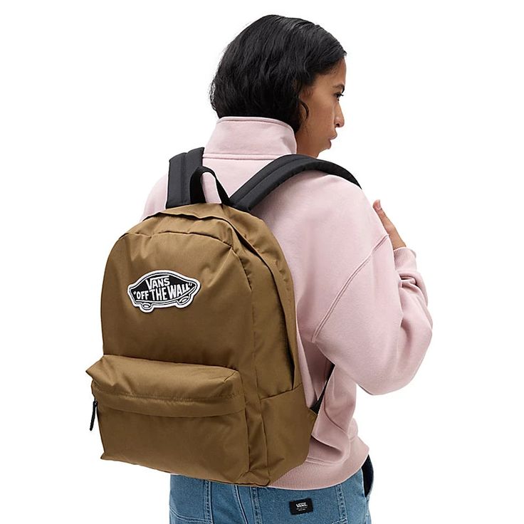 The Vans Realm Backpack is a two pocket backpack with debossed lining at the interior back panel. It has a zippered main compartment, a front organization pocket for storing items neatly and an interior laptop sleeve. It measures 42,5 H x 32,4 W x 12 D cm and has a 22-litre capacity. It has the Vans Off The Wall branding on the front. LAPTOP SLEEVE - Keep your laptop safe in a padded internal laptop sleeve. Fits most full-sized laptops. ORGANISATION - Arrange your cords, pens, and other importan Vans Functional Backpack For Back To School, Functional Vans Backpack, Functional Vans Backpack For Back To School, Classic School Backpack With Pockets, Casual Vans Backpack For Everyday Use, Vans Bags For Students Back To School, Vans Travel Backpack, Vans Bags For Back To School, Vans Everyday Backpack