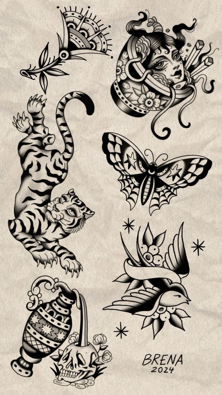 an assortment of tattoo designs on paper