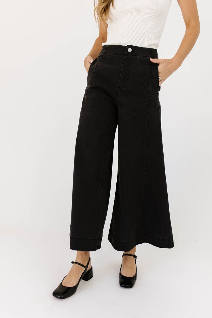 a pair of black wide-leg pants that are sooo good, you’ll never want to take them off. the high-rise + fitted waistline gives it “business casual” charisma, while the flowy loose legs keep things real + relaxed. full of versatility, you can dress them up or down for any occasion. black // wide leg, high waisted, one button zip fly, belt loops, pockets paired with our matilda mesh top + lover denim vest model is 5'8" + wearing a small measurements are approximate + taken while laying flat small : Chic Black Wide-leg Jeans, Black Wide-leg Pants For Date Night, High-waisted Black Flare Jeans For Spring, Black Mid-rise Wide Leg Pants, Chic High-waisted Pants For Elevated Casual Occasions, Chic Elevated Casual High-waisted Pants, Trendy Black Mid-rise Wide Leg Pants, Business Casual Wide Leg Leather Pants, Wide Leg Pants For Spring Date Night