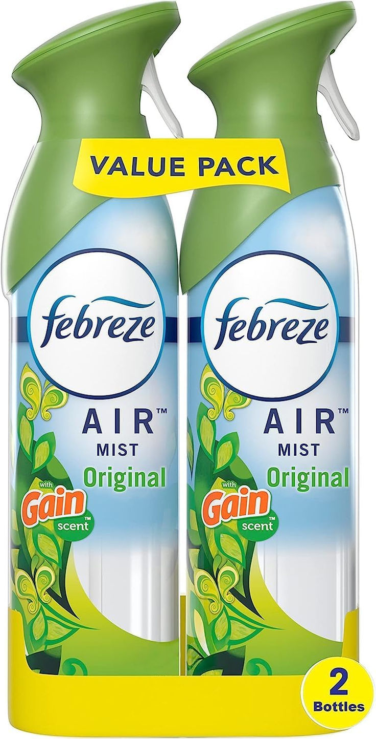 two bottles of febreze air mist are next to each other on a white background