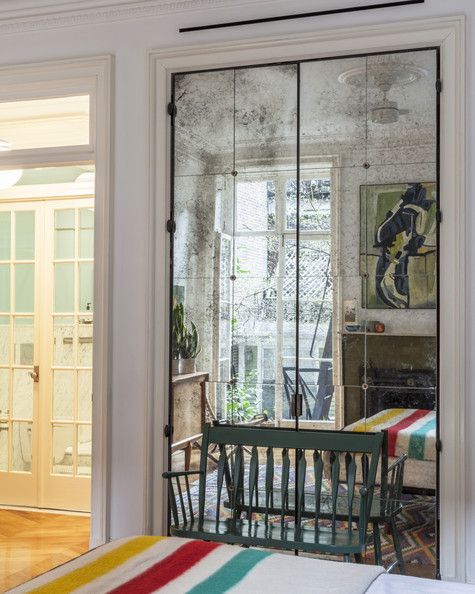 a dining room table and chairs in front of a sliding glass door