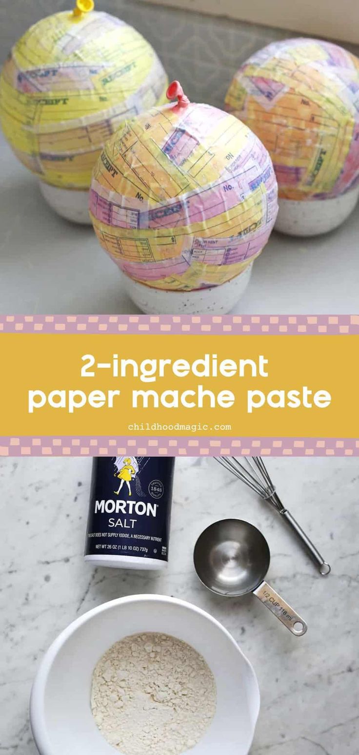 two paper mache globes sitting on top of a counter next to measuring spoons