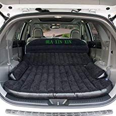 an inflatable mattress is placed inside the back of a vehicle's trunk