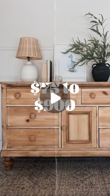 a wooden dresser sitting next to a lamp and potted plant