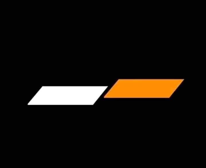 an orange and white arrow on a black background