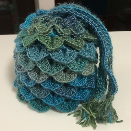 a crocheted bag sitting on top of a table