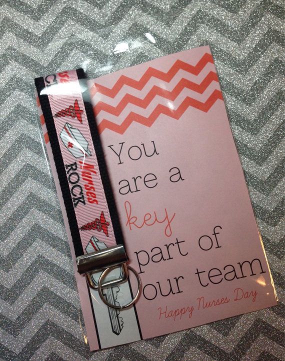 a keychain with a card attached to it that says, you are a key part of our team