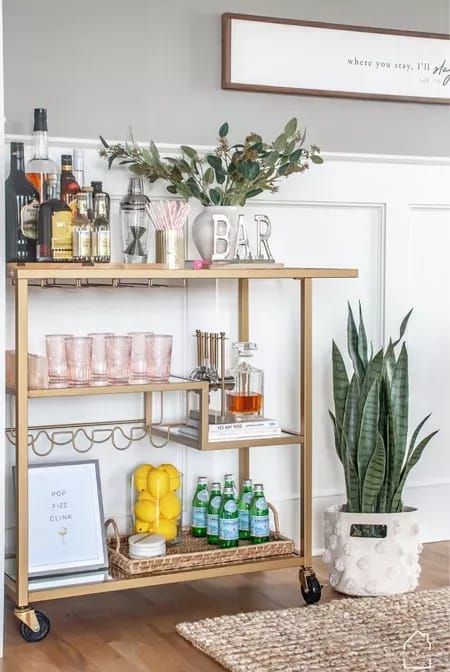 a bar cart filled with drinks and bottles