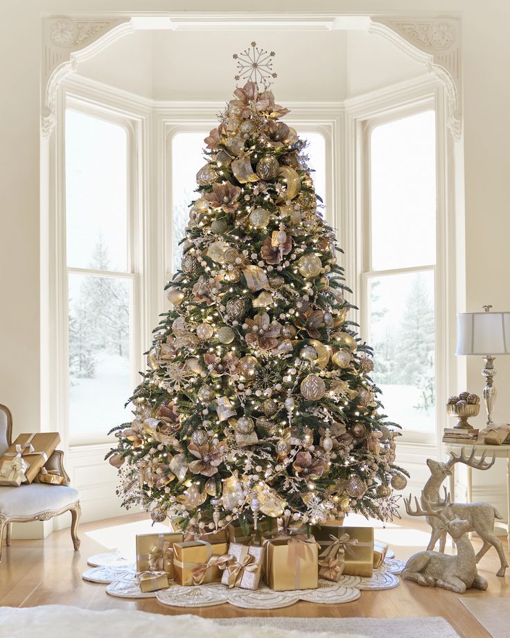 a decorated christmas tree in a living room with presents on the floor next to it