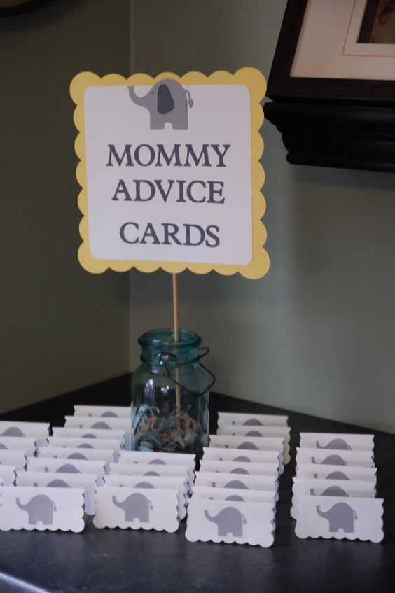 a table topped with lots of cards and an elephant sign