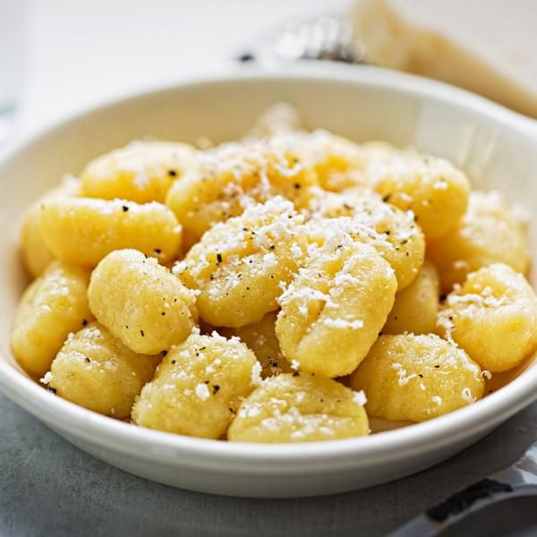 a white bowl filled with macaroni and cheese