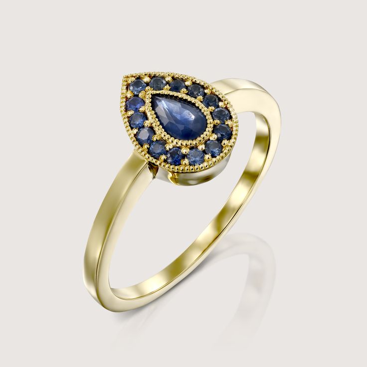 Our captivating Luna ring is our statement creation made with a pear shaped sapphire in the center of the ring. The stunning stone is lined with 14 round sapphire gems. The halo frame creates a timeless and elegant appeal. Luna is hand-made in 14k gold, and can be customized with any stones of your choosing. Check out our size chart to find the perfect size for you! **Due to the nature of the natural sapphire the color of the center stone may vary** All features can be customized! please contact us if you wish to make changes, we love making custom designs. All of our jewelry is carefully handmade in our atelier *HC diamond are all conflict free diamonds To order by phone click here>> +972(0)722991000 Yellow Gold Pear-shaped Sapphire Ring, Teardrop Yellow Gold Sapphire Ring, Yellow Gold Teardrop Sapphire Ring Fine Jewelry, Teardrop Sapphire Ring In Yellow Gold, Luxury Pear-shaped Sapphire Ring With Rose Cut Diamonds, Elegant Pear-shaped Sapphire Ring For Formal Occasions, Elegant Formal Pear-shaped Sapphire Ring, Fine Jewelry Pear-shaped Sapphire Ring, Pear-shaped Yellow Gold Sapphire Ring