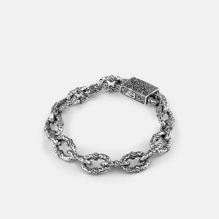 Featuring handcrafted textures and a custom clasp, this bracelet is inspired by heavy chain links found on vessels that brave the high seas. 12.5mm gauge links. Runs small, we recommend sizing up. White Gold Chunky Chain Link Bracelet, White Gold Chunky Link Chain Bracelet, White Gold Link Chain Bracelet With Chunky Chain, Metal Cuban Link Bracelet With Oval Links, Sterling Silver Bracelets With Chunky Chain In Oval Link, Timeless Chain Link Bracelet With Lobster Clasp, Luxury Chunky Chain Link Bracelet, Timeless Link Bracelets With Chunky Chain, Timeless Chunky Link Chain Bracelet