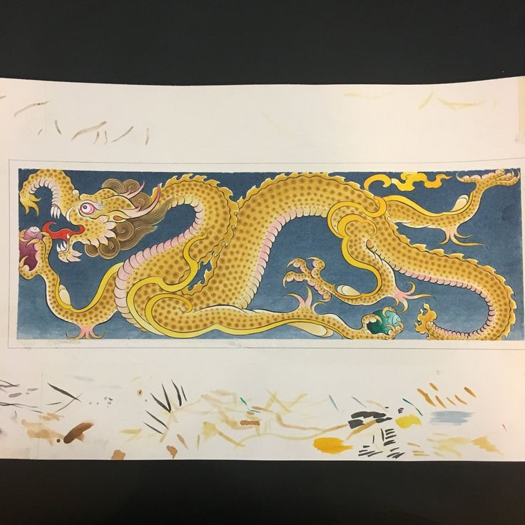 a drawing of a yellow dragon on a blue and white background with watercolors