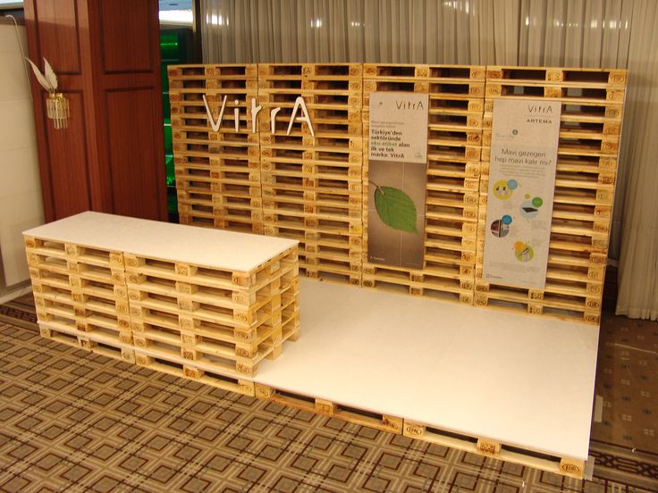 two wooden crates sitting next to each other on top of a carpeted floor in front of a wall