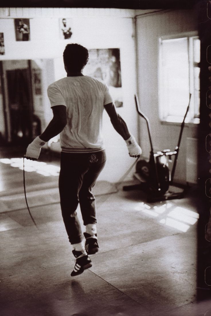 a man riding a skateboard down a hallway