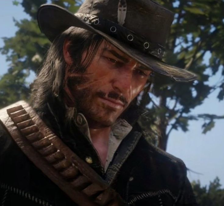 an image of a man in a cowboy hat looking to his left with trees in the background