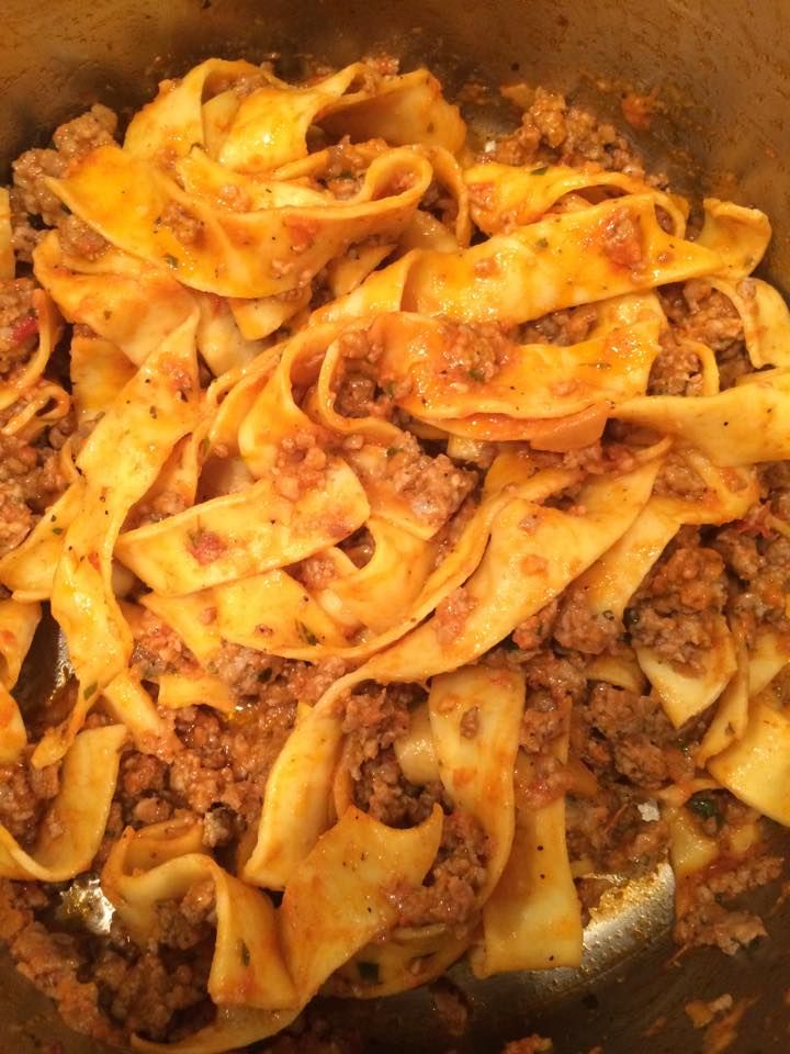 pasta with meat and sauce in a pan