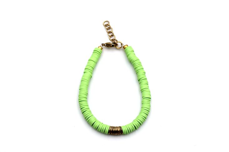 A lime green heishi bead bracelet is the perfect on-trend accessory to top off your look. It is a great stand alone bracelet and works well as a stack bracelet, too. This non-stretch bracelet features lime green polymer clay heishi beads with gold brushed metal beads in the center, all hand-strung onto flexible jewelry wire. The bracelet is finished off with a lobster clasp, and a 1" extender chain to accommodate various wrist sizes. MATERIALS Polymer Clay & Metal Beads SIZE 6 1/2" Extendable Up Green Heishi Bead Jewelry Bracelet, Green Heishi Beads Bracelet, Green Heishi Beads Bracelets For Summer, Green Heishi Beads Jewelry For Beach, Trendy Green Heishi Beads Bracelets, Green Heishi Beads Summer Jewelry, Summer Green Heishi Beads Jewelry, Lime Green Bracelet, Heishi Beads