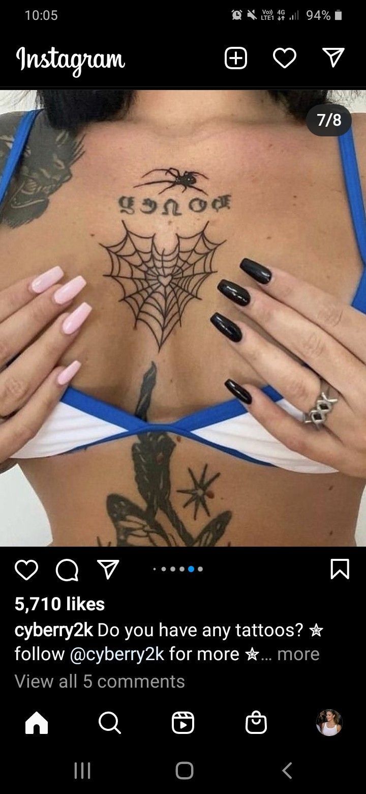 a woman's chest with tattoos on it and the words instagram above her