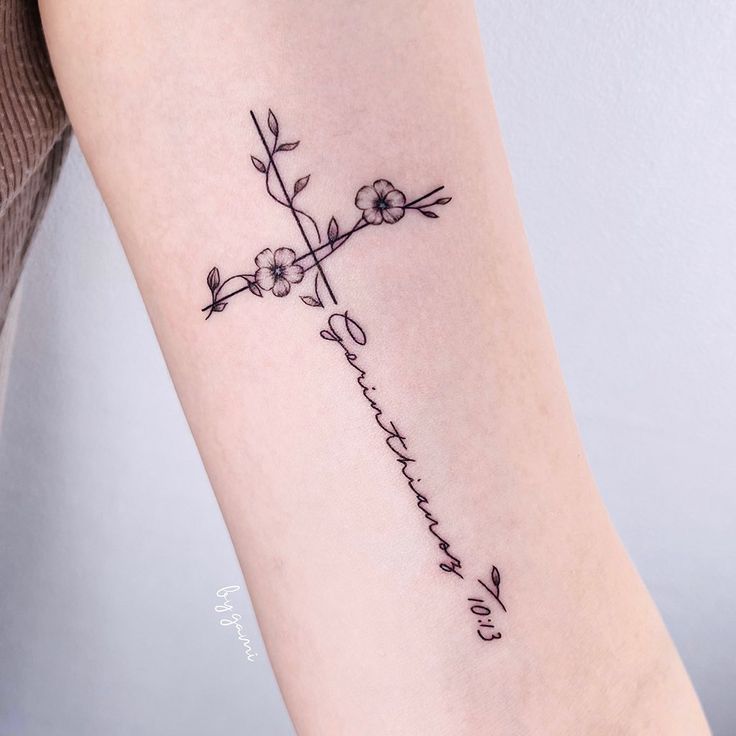 a cross with flowers on it and the word love is written in cursive writing