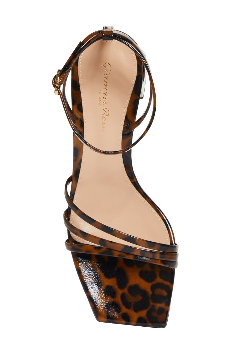 Gianvito Rossi's impeccable Italian craftsmanship shines through the premium leather and softly flared block heel of this animal-print, strappy sandal. 2 1/4" heel,57mm (size 38.5) Adjustable ankle strap with buckle closure Leather upper, lining and sole Made in Italy Designer Shoes Elegant Leopard Print Heels With Heel Strap, Leopard Print Open Heel Sandals For Party, Elegant Ankle Strap Heels In Leopard Print, Chic Leopard Print Sandals For Party, Elegant Leopard Print Open Toe Sandals, Elegant Leopard Print Ankle Strap Heels, Elegant Leopard Print Summer Heels, Chic Open Heel Leopard Print Sandals, Chic Leopard Print Open Heel Sandals