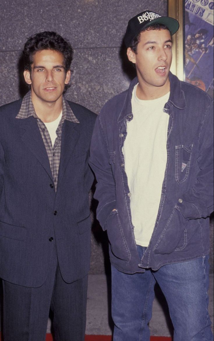 two young men standing next to each other