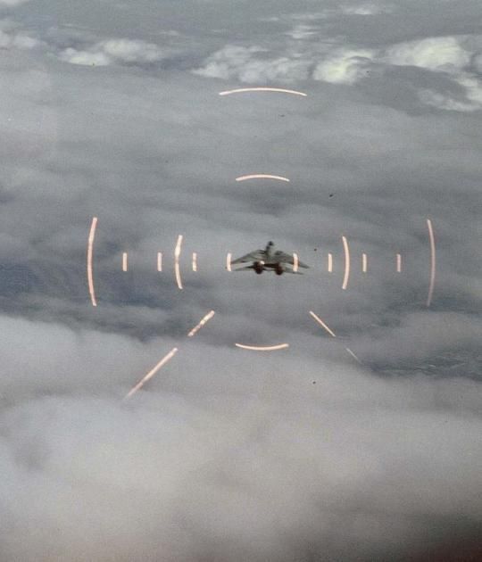 an airplane is flying through the clouds