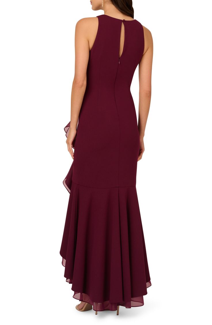 A stunning high-low silhouette brings breezy energy to this sleeveless gown with an organza ruffle draped down the front. 48" length Hidden back zip; keyhole with button-and-loop closure Jewel neck Sleeveless Lined 95% polyester, 5% elastane Dry clean Imported Sleeveless Maxi Dress With Ruffle Hem For Prom, Sleeveless Ruffle Gown For Bridesmaids, Sleeveless Ruffled Skirt Evening Dress For Gala, Formal Ruffled Mermaid Hem Maxi Dress, Sleeveless Ruffle Hem Maxi Dress For Wedding, Sleeveless Ruffled Maxi Dress For Prom Season, Sleeveless Maxi Dress With Ruffle Hem For Wedding, Elegant Gown With Ruffled Straps For Gala, Sleeveless Evening Gown With Ruffles