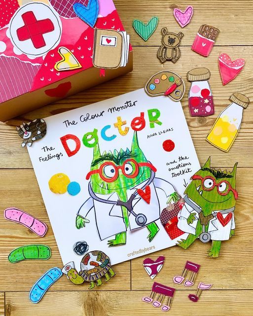 the children's book doctor is surrounded by cut outs and magnets on a wooden floor