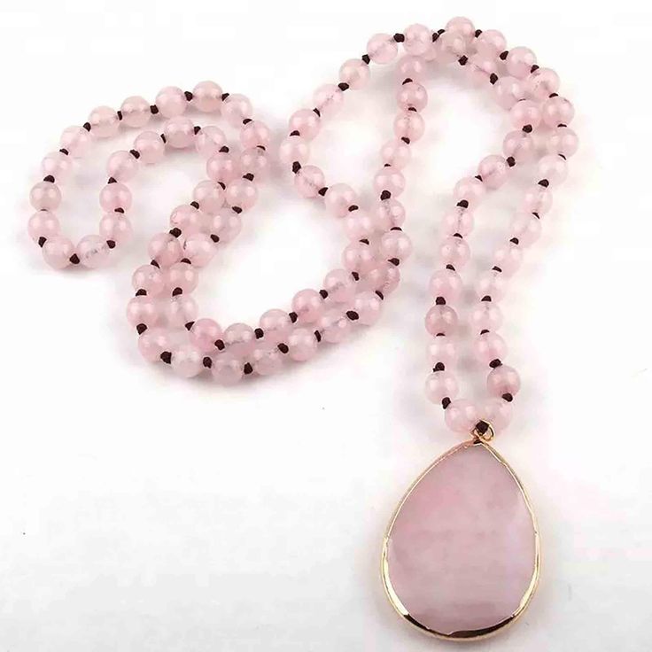 Rose quartz has the ability to attract love. It attracts love into your world in all its forms; romantic love, but also friendship, nurturing, and communication with peers and partners. It also has a strong association with self-love. The Natural rose quartz stone is attached to the heart chakra and throat chakra. The stone has been used in the past as a symbol of good luck Healing With Rose Quartz ♥ Love ♥ Peace ♥ Kindness ♥ Friendship ♥ This Inner Peace Knotted Mala Necklace will be a perfect Jewelry Vendor, Rose Quartz Jewelry, Stone Beaded Necklace, Drop Pendant Necklace, Fashion Bohemian, Quartz Jewelry, Bohemian Necklace, Mala Necklace, Stone Pendant Necklace