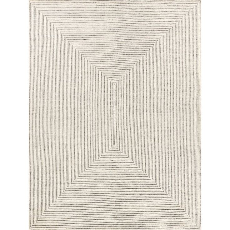 a white rug with lines in the shape of a rectangle on top of it