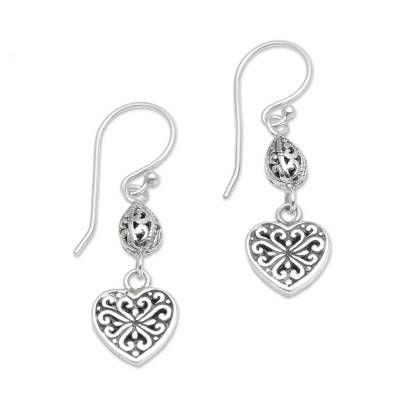 Combining traditional Balinese motifs with modern design artisan Cahya Krisna creates this wonderful pair of dangle earrings that are perfect for all occasions. Handcrafted from sterling silver each earring features a beautiful heart decorated with swirling bun openwork crowned with an intricately detailed seed. The word hatiku means my heart in Indonesian. Silver Bohemian Heart Earrings For Gift, Traditional Heart-shaped Sterling Silver Jewelry, Formal Heart-shaped Sterling Silver Earrings, Bohemian Handmade Sterling Silver Heart Earrings, Bohemian Silver Heart-shaped Earrings, Silver Dangle Earrings, Sterling Silver Dangle Earrings, Beautiful Heart, Balinese