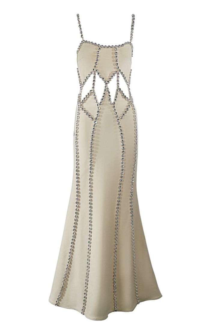 a white dress with silver beads on the bottom and side, in front of a white background