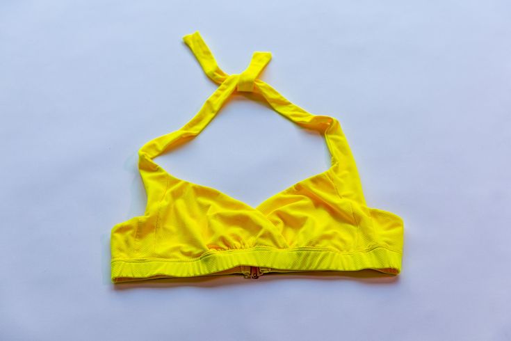 UV Protection The model is wearing a size Small Self 92% PO 8%PU Lining 82% NY 18%PU Rinse with mild soap after swimming Hand to dry in shade to dry naturally Made in NYC CA22107 Summer T-back Tops For The Beach, Yellow Halter Top For Poolside Beachwear, Yellow Beachwear Halter Top For Poolside, Yellow Summer Halter Top For Poolside, Yellow Beachwear Top For Poolside, Summer Sports Halter Neck Swimwear, Summer Triangle Top For Pool, Summer T-back Halter Top For Pool, Summer Triangle Top For Swimming