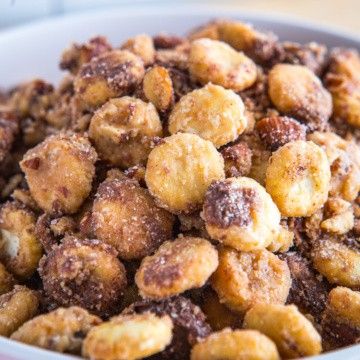 a white bowl filled with fried food on top of a table