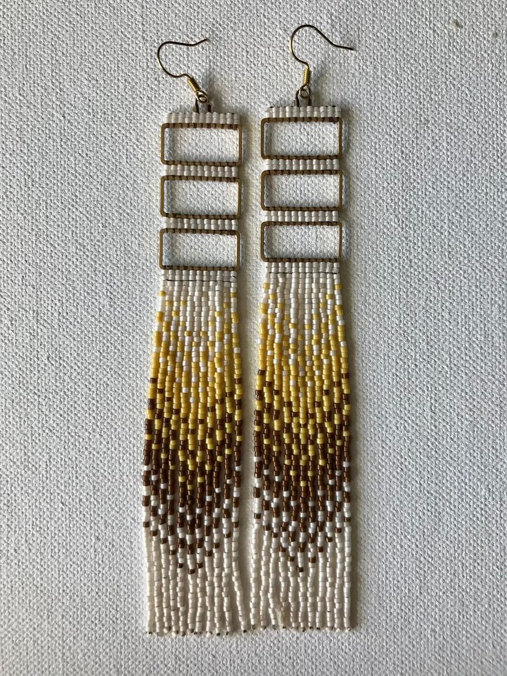 "Triple brass rectangle hand beaded earrings.  Ivory, brown, and soft yellow. Approximate 6\" length Modeled photo is to show size" Hand Beaded Earrings, Stitch Earrings, Brick Stitch Earrings, Soft Yellow, Brick Stitch, Hand Beading, Model Photos, Vintage Brass, Beaded Earrings