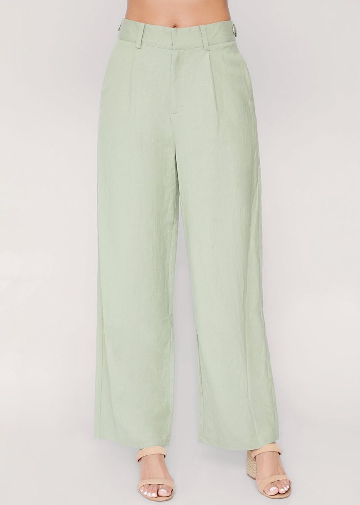 So sweet in a flattering shade of sage green, these wide-leg pants feature a high-rise silhouette with a fitted button front waist, and side pocket inserts for a timeless, wear-with-everything staple. Imported 55% Linen, 45% Rayon Model is 5 ft 9.5 inches; Bust: 33", Waist: 27.5", Hips: 39" and wearing a size Small Runs true to size Hand wash or wash with gentle cycle with cold water with like colors, Air dry to avoid shrinkage Spring Casual Light Green Bottoms, Chic Green Relaxed Fit Bottoms, Green Wide-leg Workwear Pants, Chic Green Cotton Pants, Green Wide Leg Pants For Work, Green Relaxed Fit Pants For Workwear, Relaxed Fit Wide Leg Pants With Button Closure, Chic Green Wide Leg Bottoms, Chic Green Pants With Pockets