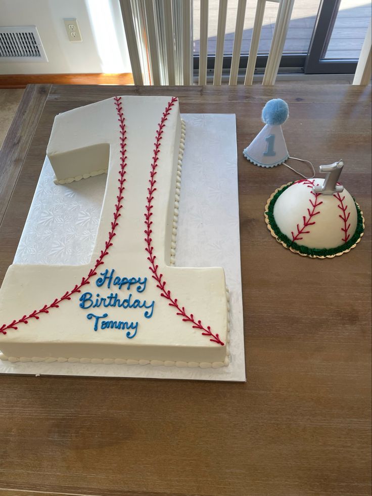 a baseball themed birthday cake on a table