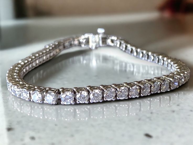 AMAZING Vintage 14k White Gold 8 CTW Diamond Tennis Bracelet! * Crafted beautifully in 14k white gold with fifty four (54) - approximately .15CT bright and clear round cut sparkling diamonds!! * Approximately 8 CTW  * G/H color VS/SI1 clarity! * Bracelet is approximately 7.25" long and 3.75mm wide. * Weighs 14 Grams of solid 14k white gold! * Clean and sparkling!! Shipped FAST AND FREE, in gift box and fully insured White Sterling Silver Tennis Bracelet For Anniversary, Sterling Silver Tennis Bracelet With Vvs Clarity For Anniversary, Dazzling Silver Tennis Bracelet With Diamond Accents, Vvs Clarity Sterling Silver Tennis Bracelet For Anniversary, Anniversary Sterling Silver Moissanite Bracelet, Diamond Cut, Formal White Gold Sterling Silver Tennis Bracelet, White Sterling Silver Bracelet With Diamond Cut, White Sterling Silver Bracelet With Diamond Cut Cubic Zirconia, Timeless Silver Tennis Bracelet With Diamond Accents