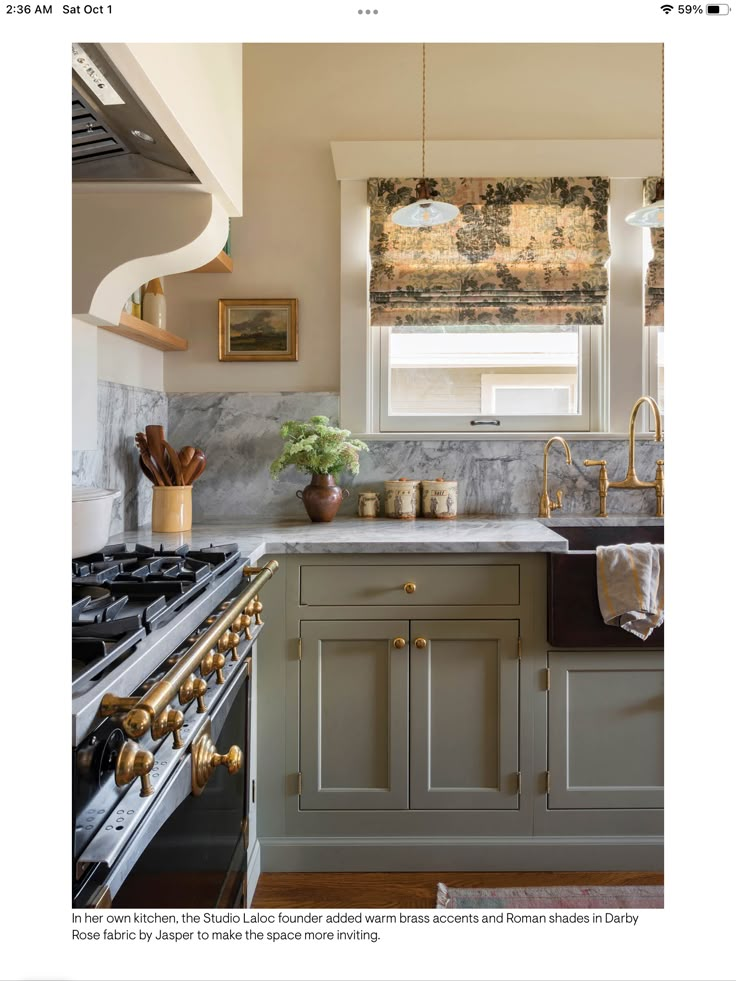 a kitchen with marble counter tops and gold accents